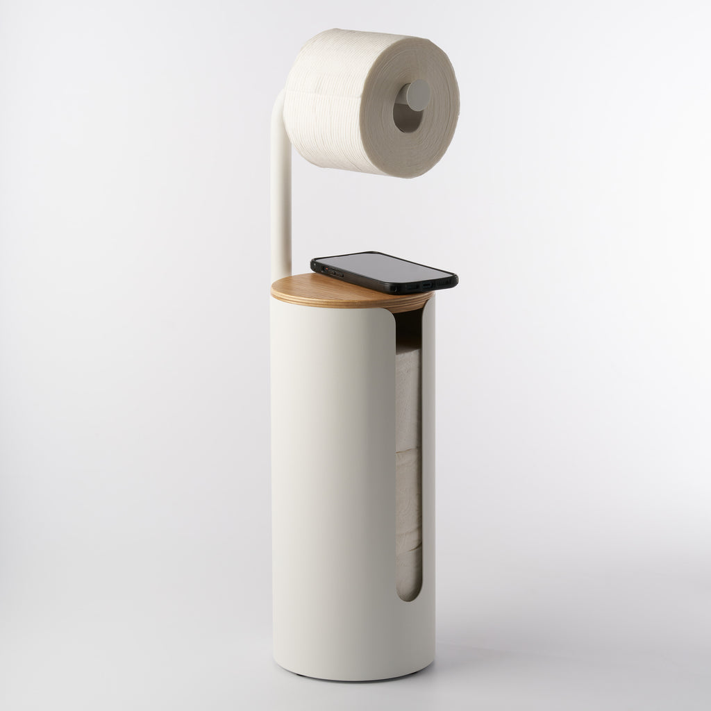 Apto Aloft Toilet Paper Stand with Storage in white with a phone resting on the wood lid and a roll on the arm, shown on a white background