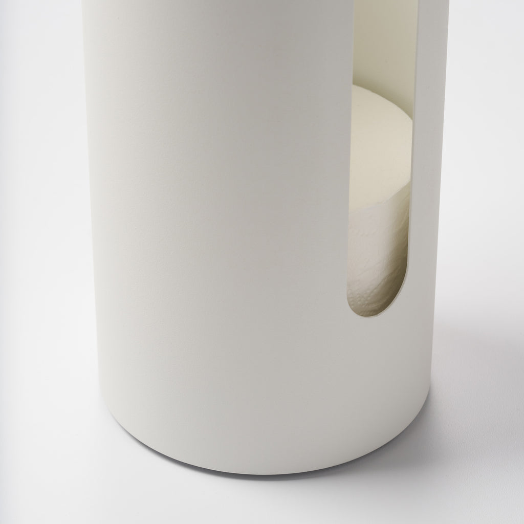 Close-up of the side cutout on the Apto Aloft Toilet Paper Stand with Storage in white steel, showing spare rolls stored inside the base
