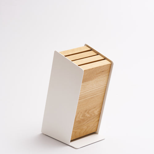 Universal knife block made of steel and wood from Apto without knives on a white background. 