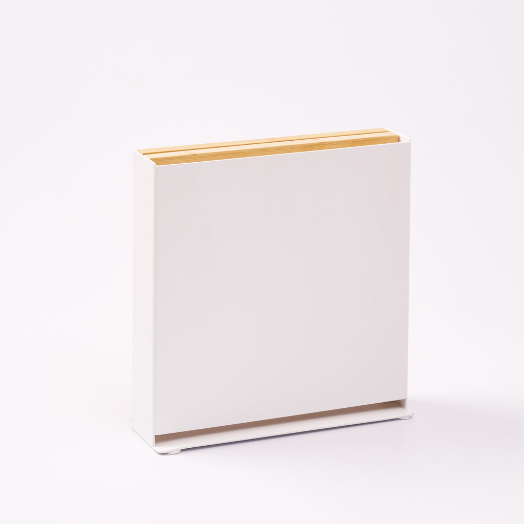 Universal knife holder from Apto with bamboo removable cutting board, showing the steel side of the stand. Designed by Apto. 
