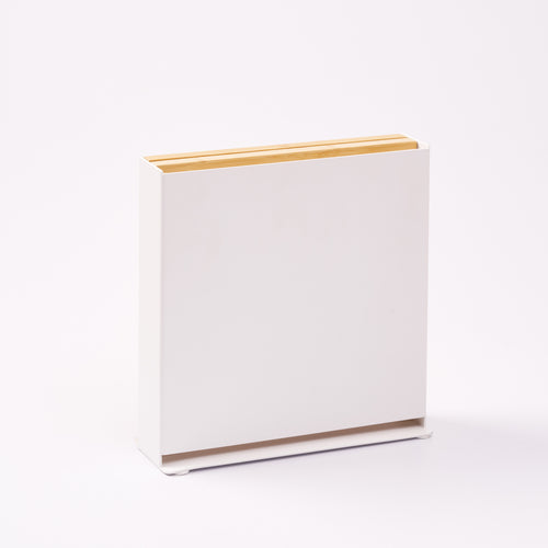 Universal knife holder from Apto with bamboo removable cutting board, showing the steel side of the stand. Designed by Apto. 