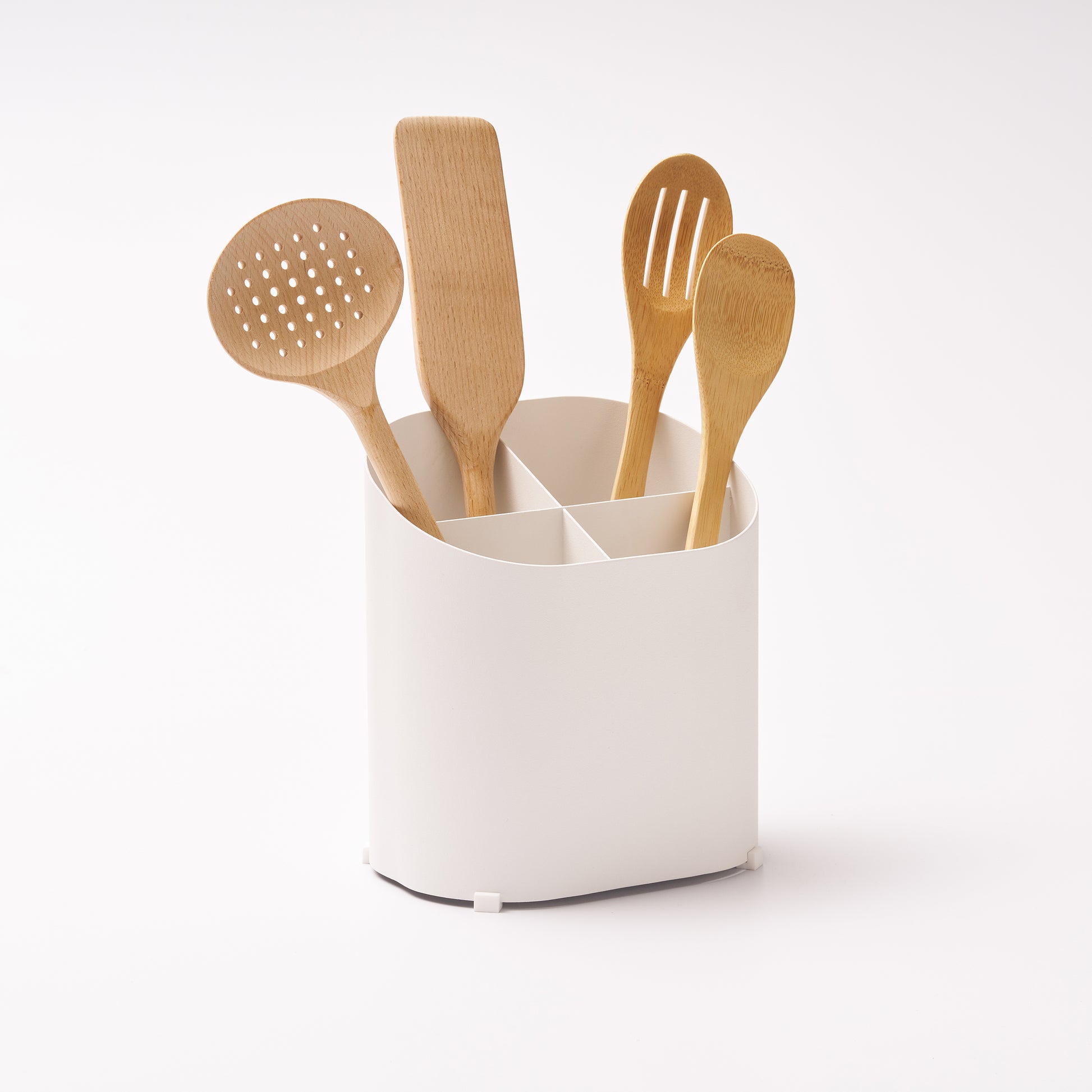 Sloped Utensil Holder holding kitchen utensils
