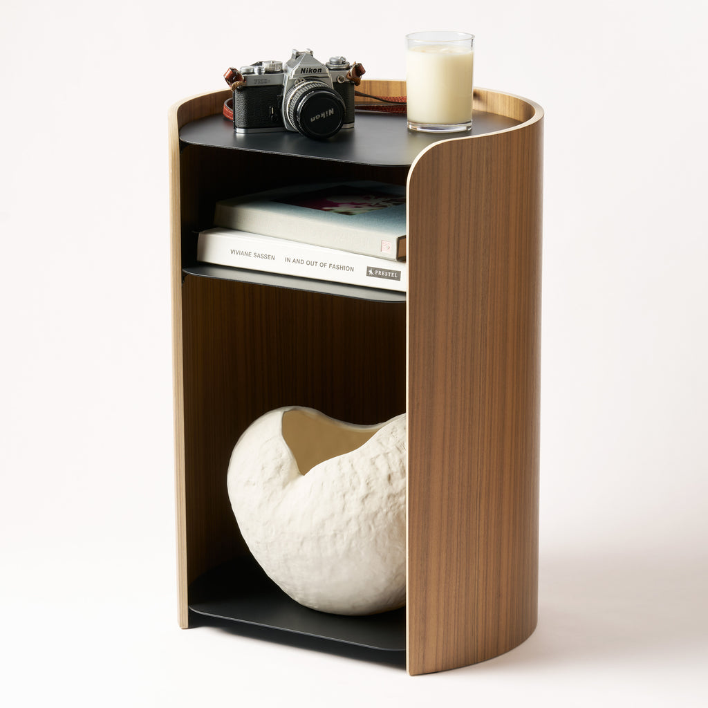 Contour Side Table - Steel + Wood in Black with various props against a white background