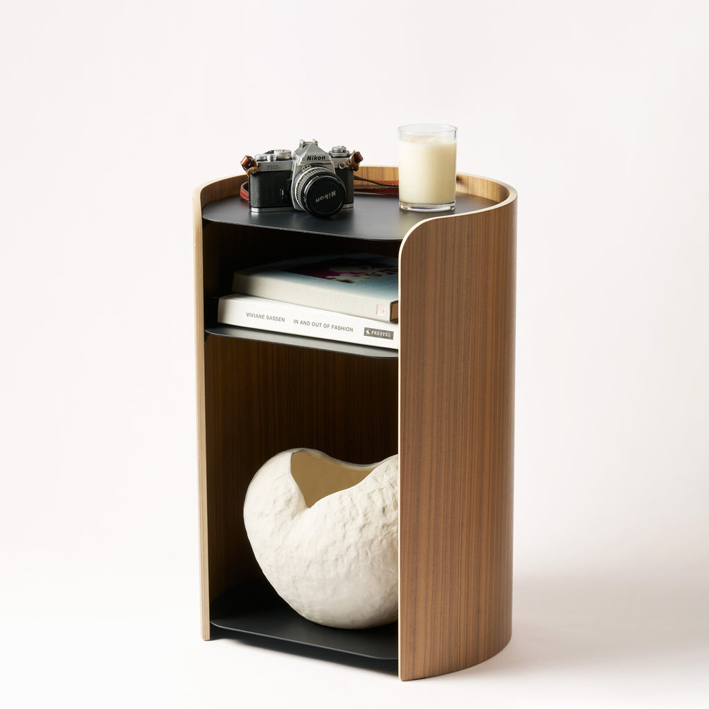 Contour Side Table - Steel + Wood in Black with various props against a white background