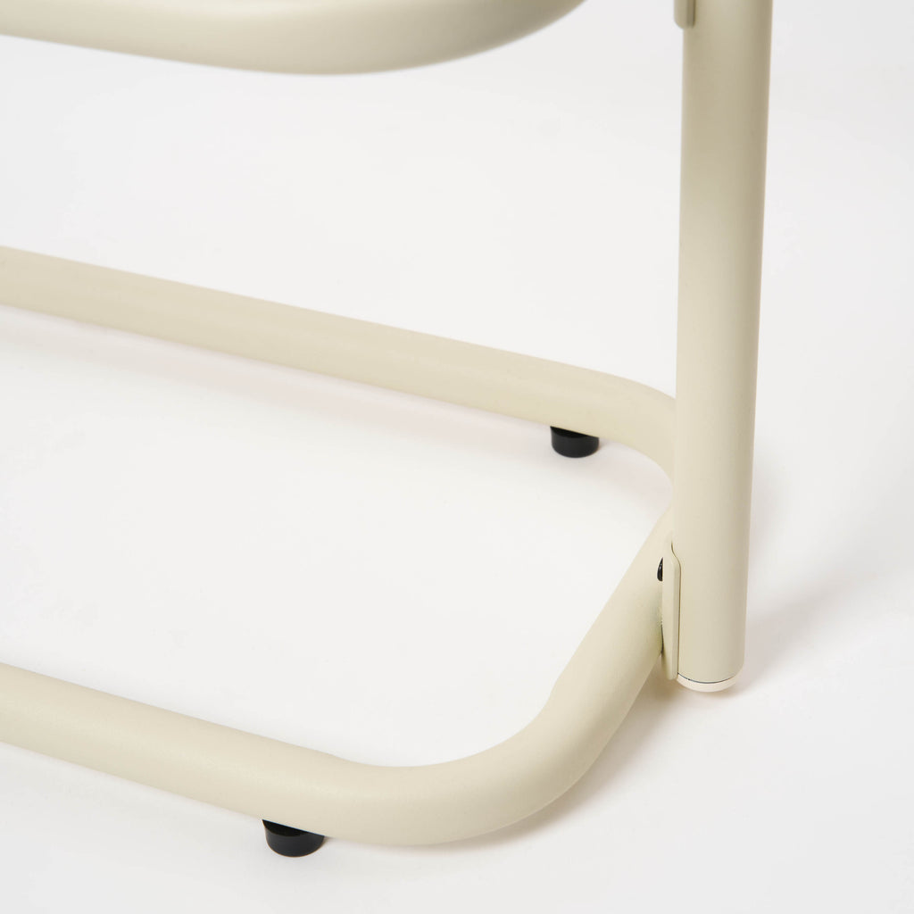 Bottom of the Ivory Obround steel shoe rack from Apto, showing four protective footers. 